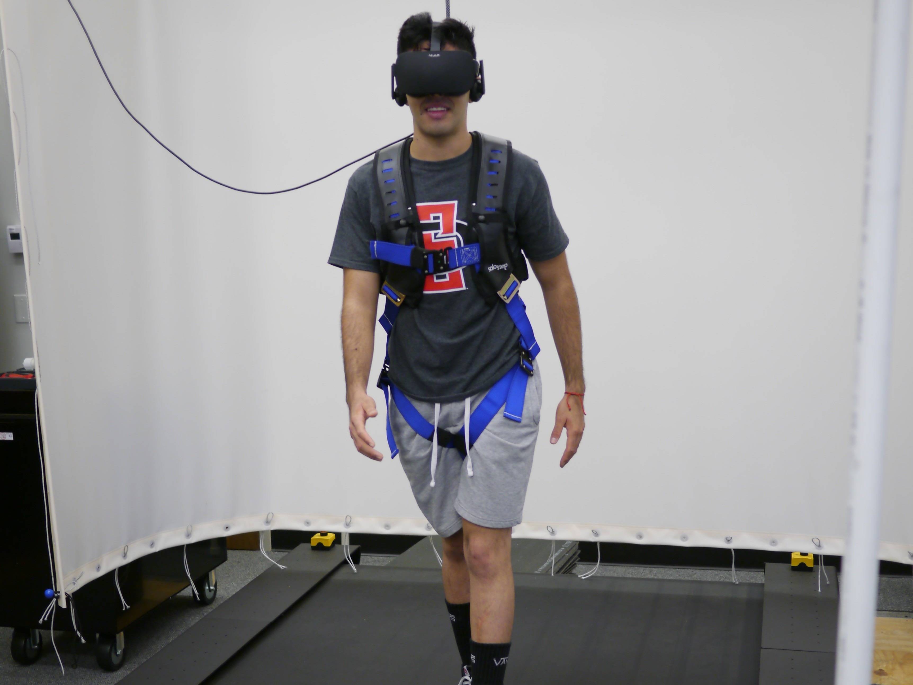 ENS Student walking on treadmill with VR