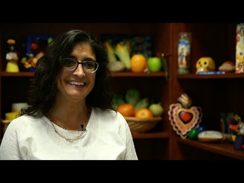 Guadalupe sitting in office