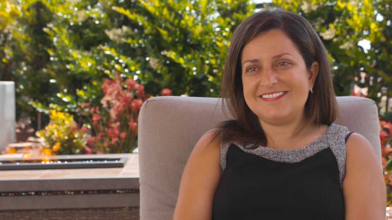 Hala sitting in a patio chair