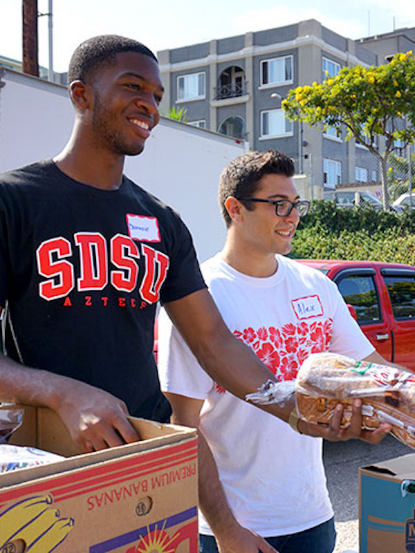 SDSU Students volunteering to hand out food to community
