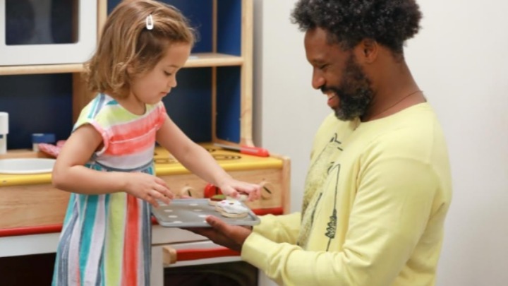 Johnathan Robinson Anthony, Ph.D. student & speech-language pathologist speaks with a child in SDSU’s Speech, Language, & Hearing Sciences Clinic
