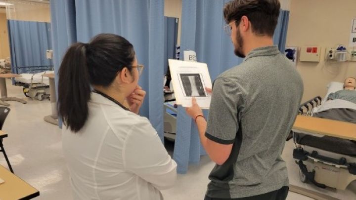 Students reviewing an x-ray picture at the nursing simulation lab